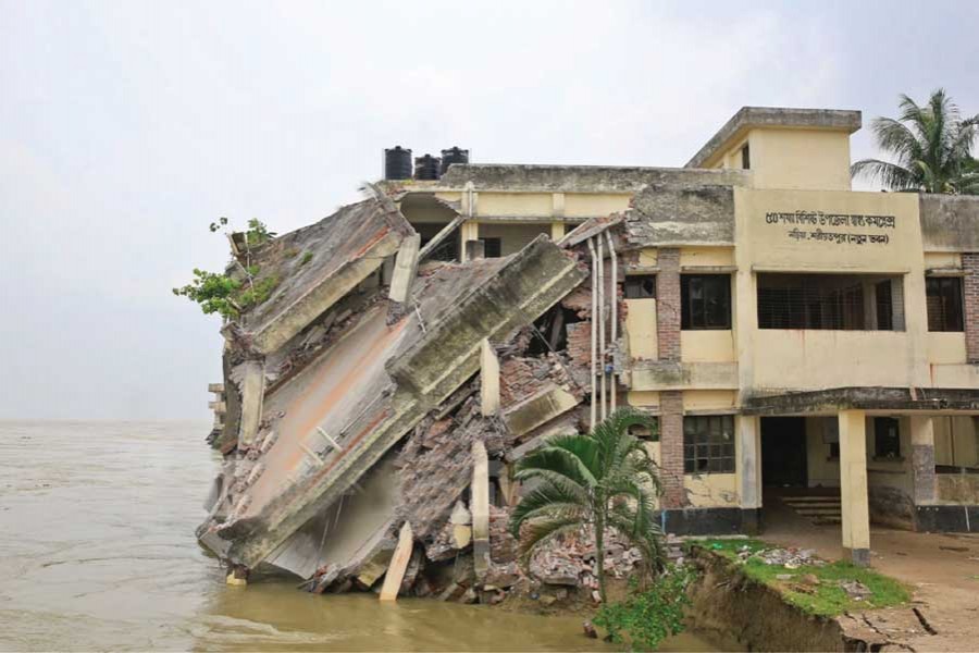Naria Upazila Health Complex  sinks as the Padma  river erodes its banks in Shariatpur  last week.         — Photo:  bdnews24.com