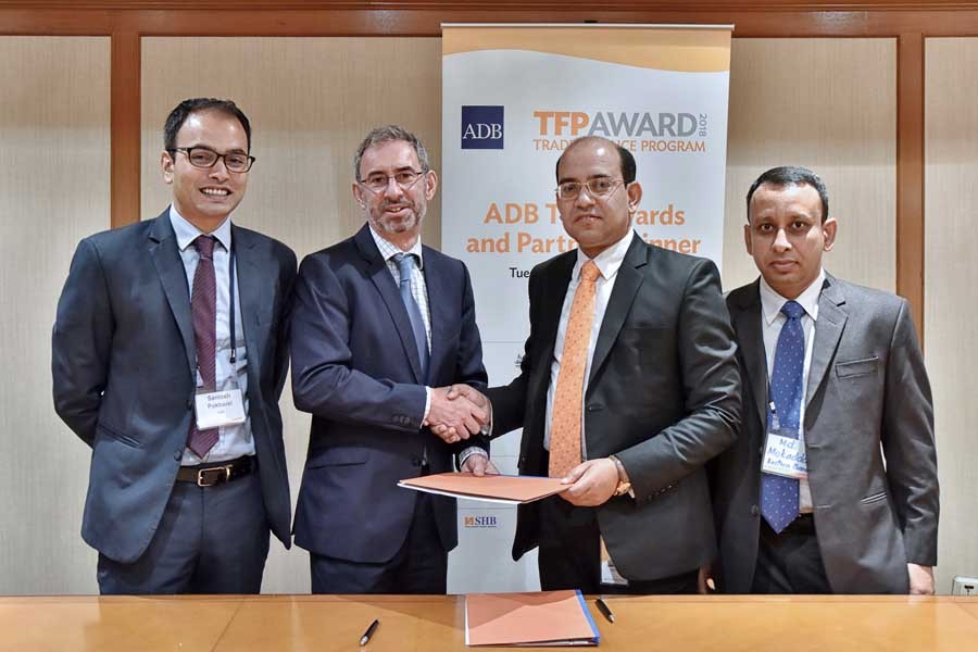 Steven Beck, Head of Trade and Supply Chain Finance of ADB, and Md. Obaidul Islam, Executive Vice President and Head of Financial Institutions and Offshore Banking of EBL exchanging documents after signing a Trade Facilitation deal in Singapore recently