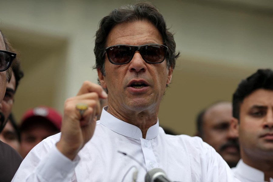 Cricket star-turned-politician Imran Khan, chairman of Pakistan Tehreek-e-Insaf (PTI), speaks after voting in the general election in Islamabad, Pakistan July 25, 2018. Reuters/File photo