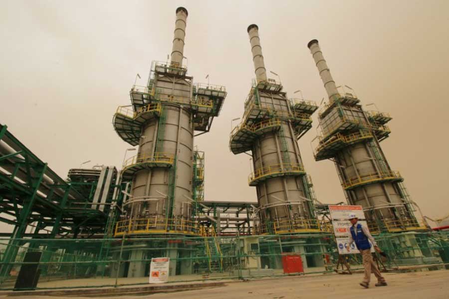 A worker walks at the Zubair oilfield in Basra, Iraq May 9, 2018. Reuters/Files