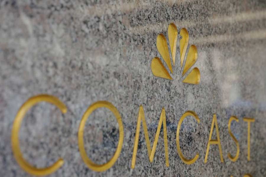 The NBC and Comcast logos are displayed on 30 Rockefeller Plaza in midtown Manhattan in New York, US, February 27, 2018. Reuters/File Photo