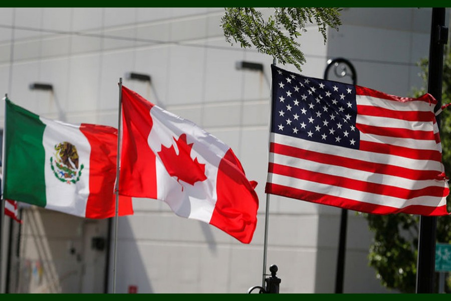 Flags of the US, Canada and Mexico fly next to each other in Detroit, Michigan, US, August 29, 2018. Reuters/File Photo