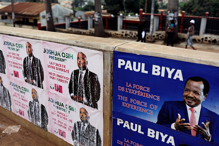 Electoral Placards of Cameroon President Paul Biya (R) and candidate Joshua Osih of Social Democratic Front party are pictured in Yaounde, Cameroon on Friday — Reuters photo