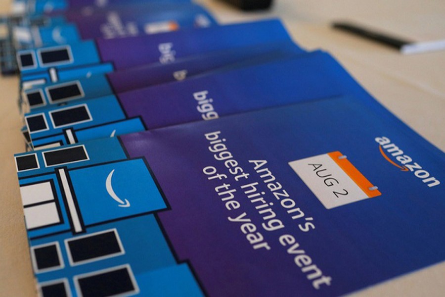 Brochures are available for potential job applicants at "Amazon Jobs Day" at the Amazon.com Fulfillment Center in Fall River. Reuters