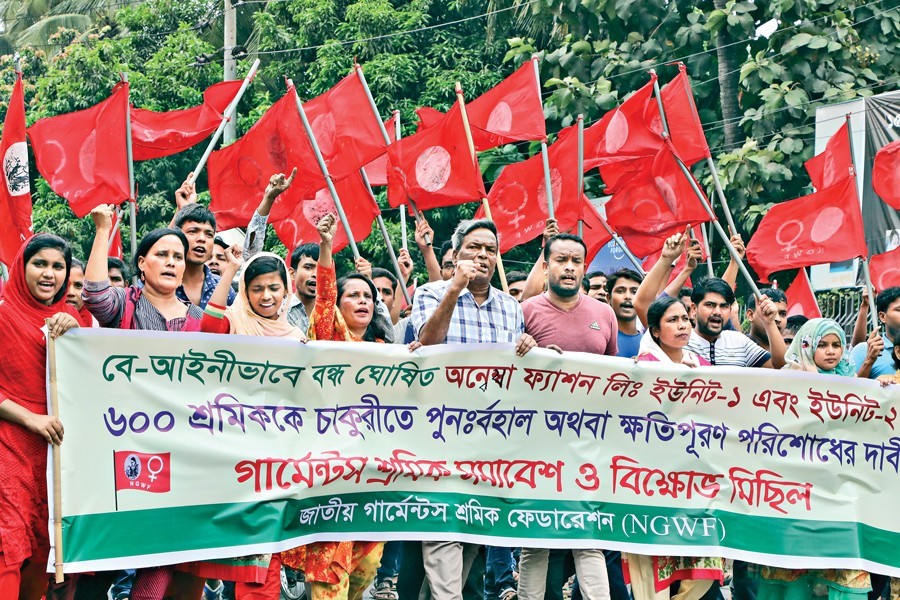 Garment workers under the banner of National Garment Workers Federation (NGWF) staging a rally in the city on Thursday demanding reinstatement of 600 workers in their jobs by Annesha Fashion Ltd — FE photo