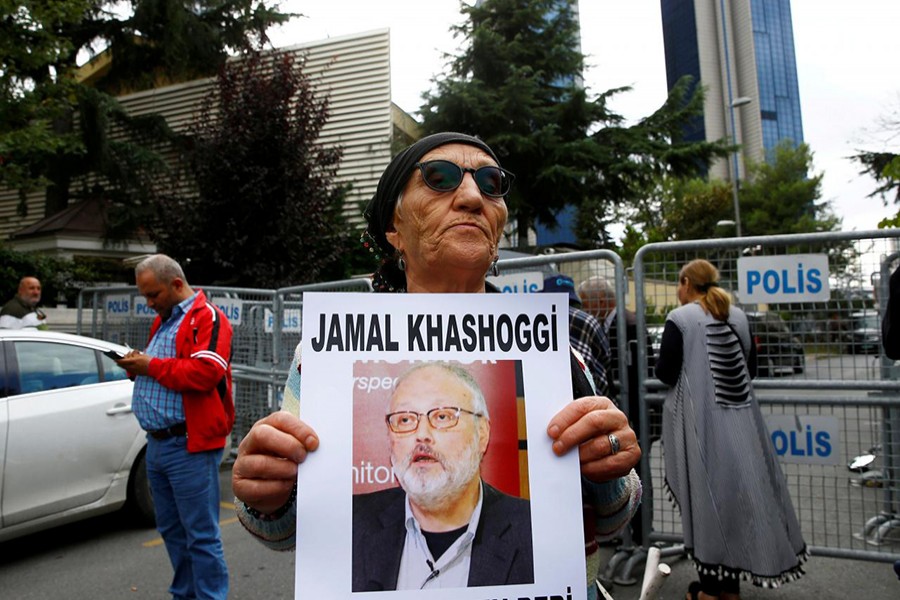 A human rights activist holds picture of Saudi journalist Jamal Khashoggi during a protest outside the Saudi Consulate in Istanbul, Turkey on October 9 — Reuters photo