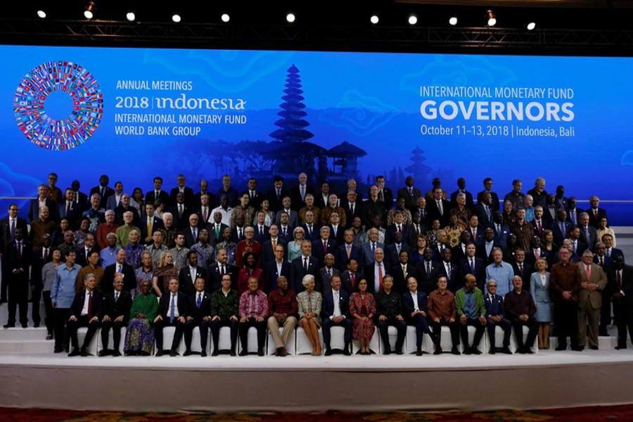 IMF Managing Director Christine Lagarde (CF), Central Bank governors and finance ministers pose for a group photo at the International Monetary Fund - World Bank Group Annual Meeting 2018 in Nusa Dua, Bali, Indonesia, October 13, 2018. Reuters