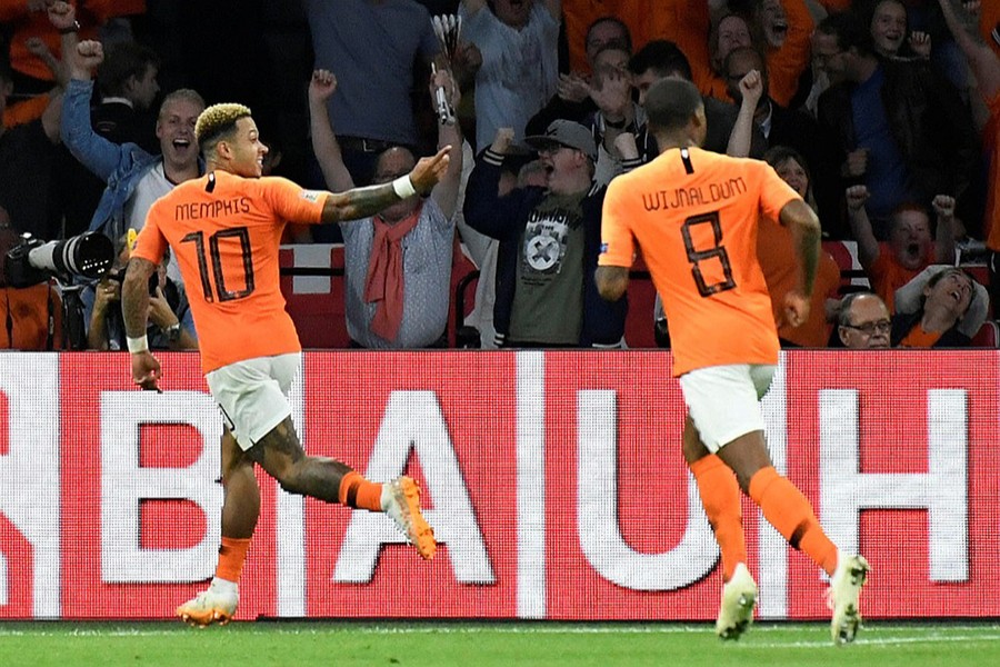 Netherlands' Memphis Depay celebrates scoring their second goal with Georginio Wijnaldum — Reuters photo