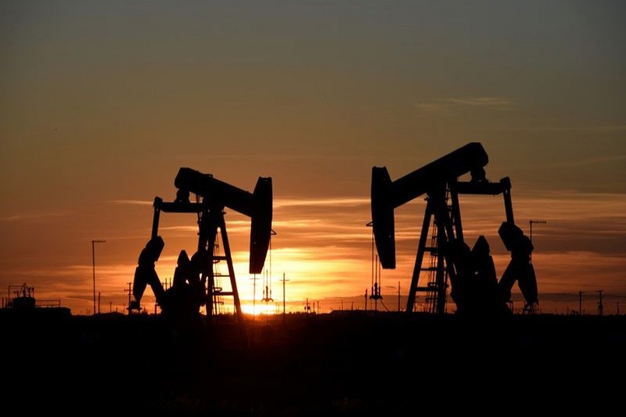 Pump jacks operate at sunset in an oilfield in Midland, Texas, US, August 22, 2018. Reuters/File Photo