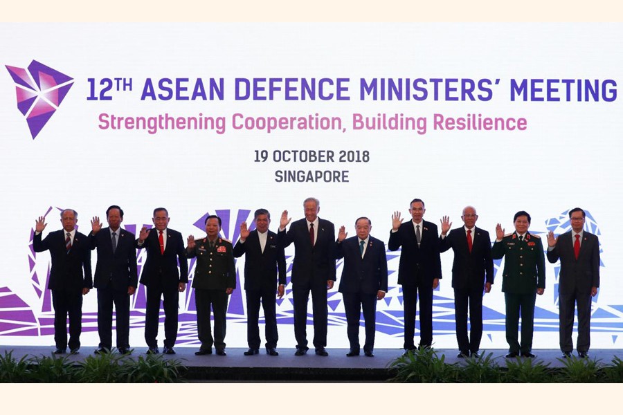 ASEAN defence ministers posing for a group photo at the ASEAN Defence Ministers' Meeting in Singapore on Friday	— Reuters