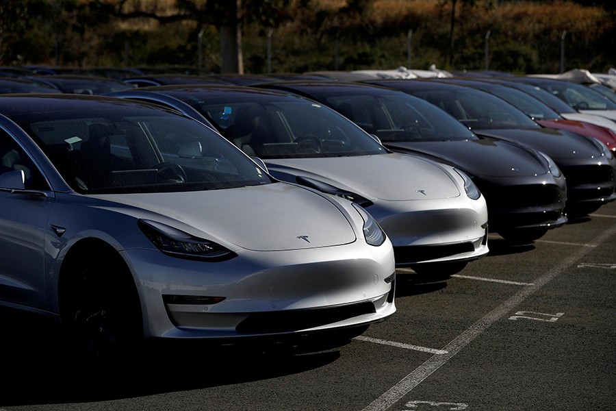 A row of new Tesla Model 3 electric vehicles is seen at a parking lot in Richmond, California, US on June 22, 2018 — Reuters/File