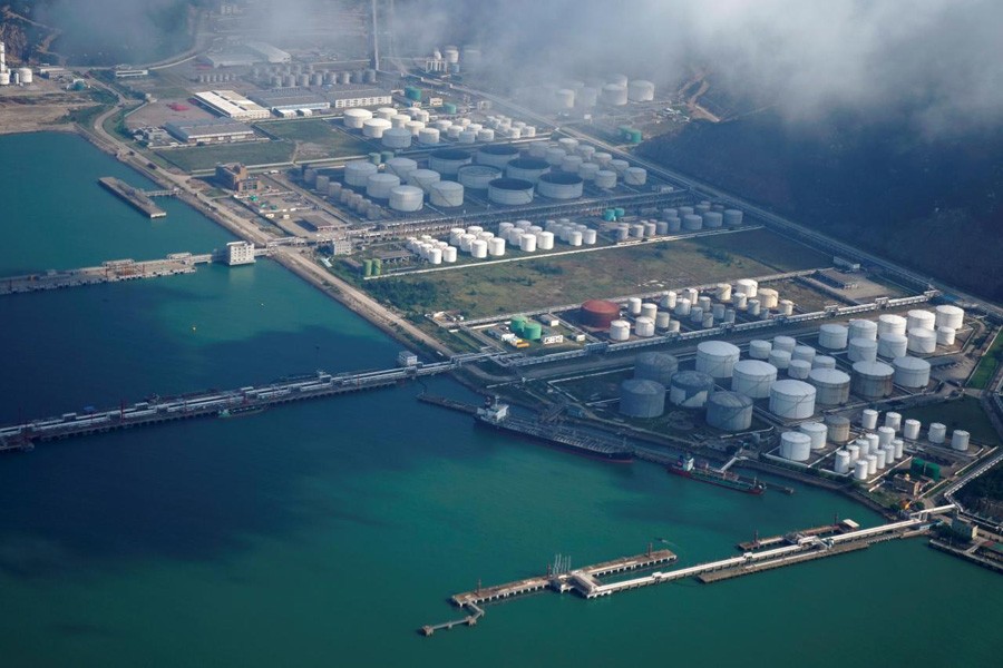 Oil and gas tanks are seen at an oil warehouse at a port in Zhuhai, China, October 22, 2018. Reuters