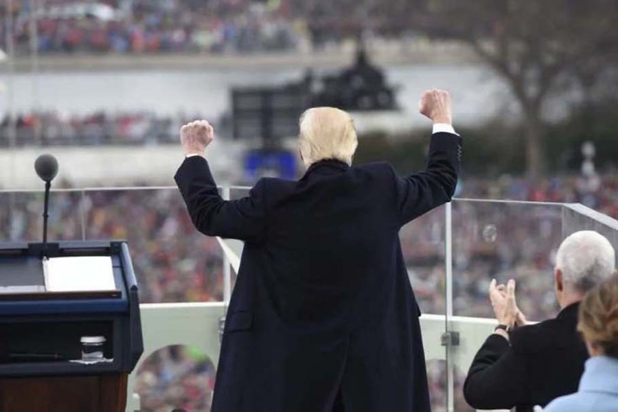 President Trump pumps his fists after his inaugural speech on January 20, 2017. 	- AP
