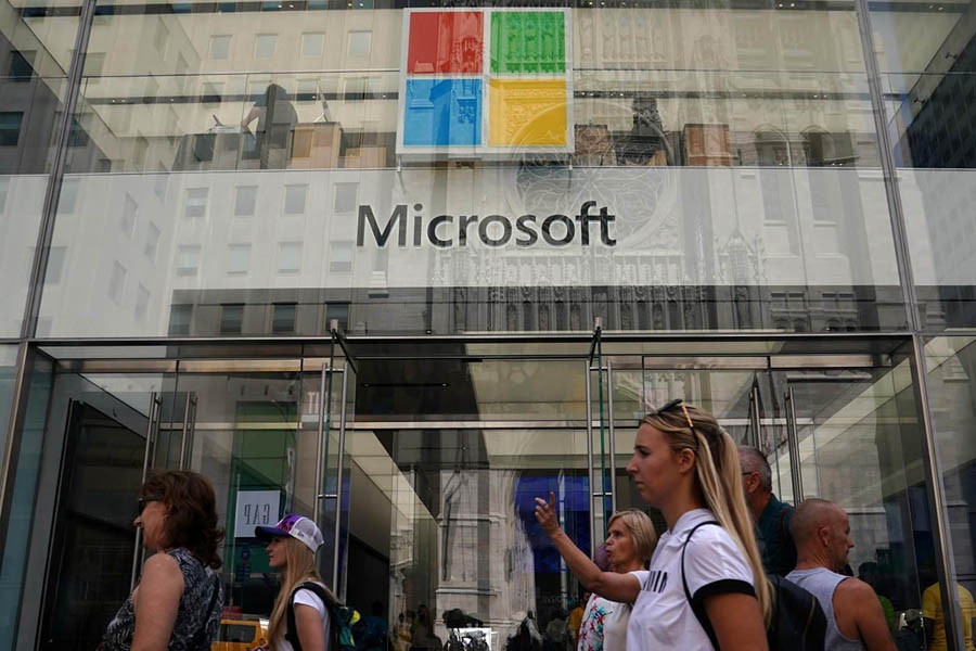 Visitors seen at a Microsoft store in New York City, US recently	— Reuters