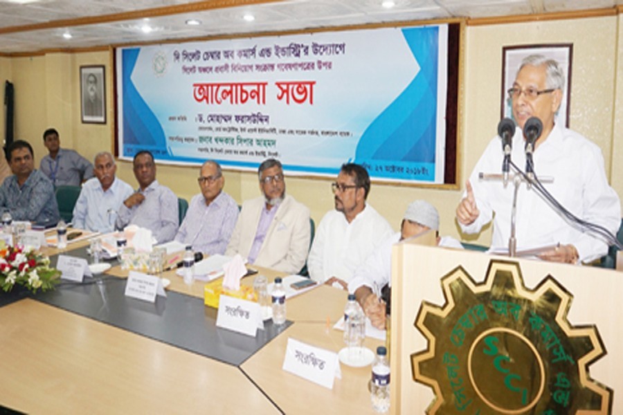 Former Bangladesh Bank Governor Dr Mohammed Farashuddin speaking as the chief guest at a discussion at Sylhet Chamber Building on Saturday — FE photo