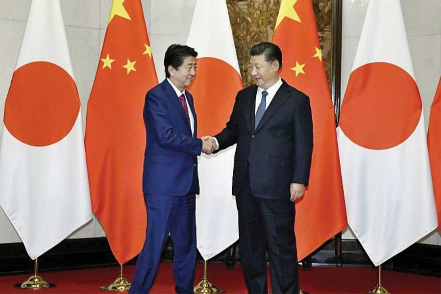 President Xi Jinping and Prime  Minister Abe  greet each other in Beijing on October 26, 2018: "Abe's Beijing visit, first of all, implicitly acknowledges China's ascendancy. That is the only reason why China is willing to put the East China Sea disputes on the back-burner".  	—Photo; Reuters