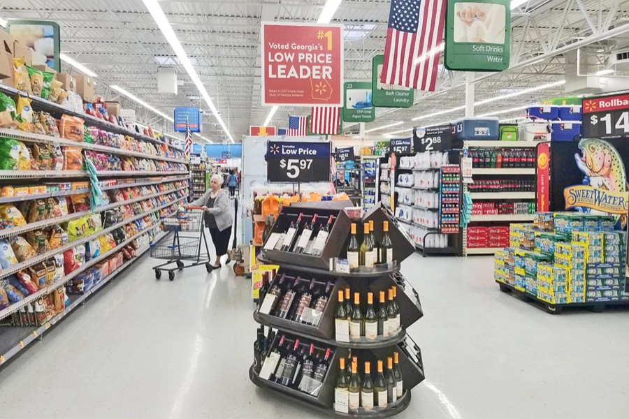 A file photo showing a shopper in the aisle of a Walmart store in Woodstock, Georgia, US 	—  Reuters