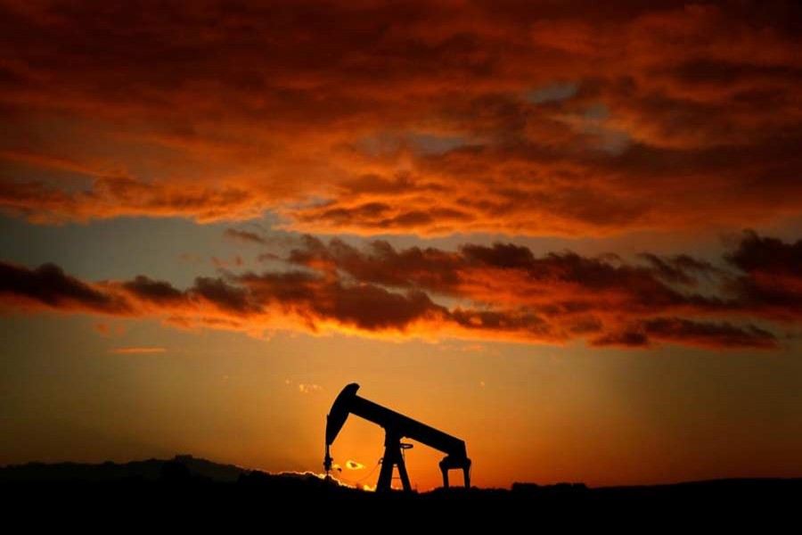 A pump jack is seen at sunset outside Scheibenhard, near Strasbourg, France, October 6, 2017. Reuters/Files