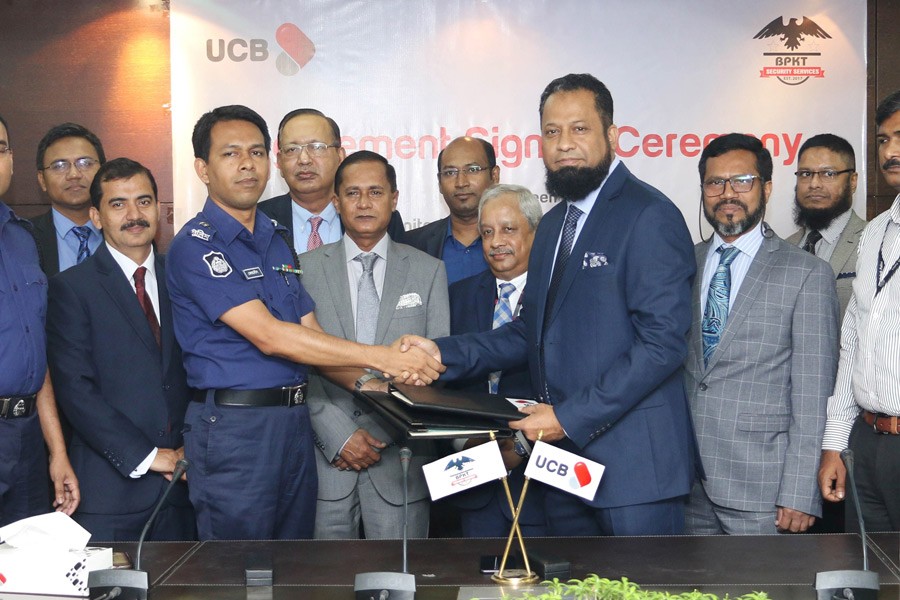 N Mustafa Tarek, Deputy Managing Director of UCB and Ferdoush Ali Chowdhury, Assistant Inspector General of Police signing the agreement between UCB and Bangladesh Police Kallyan Trust Security Service with the presence of Managing Director (Acting) of UCB Mohammed Shawkat Jamil