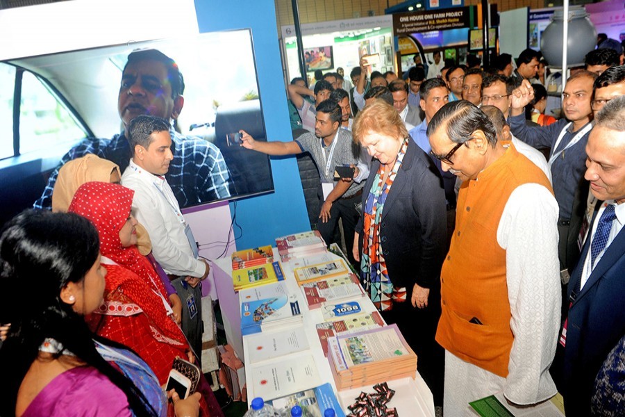 Social Welfare Minister Rashed Khan Menon going round the fair after inaugurating the Bangladesh Social Security Conference 2018 at Bangabandhu International Conference Centre in the city on Sunday — PID