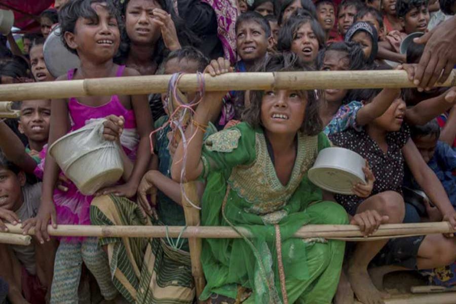 Rohingya Muslim children, who crossed over from Myanmar into Bangladesh, wait squashed against each other to receive food handouts distributed to them at Thaingkhali refugee camp in Cox's Bazar, Bangladesh, in October, 2017. Photo: AP