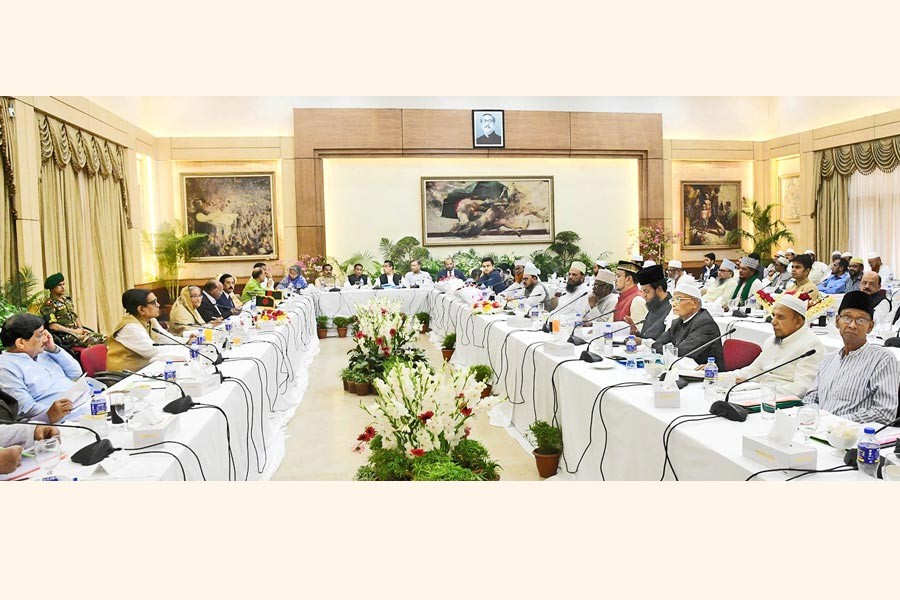 The 14-party alliance led by Prime Minister Sheikh Hasina holding talks with Islami Oikyajote, a coalition of eight Islamic parties, over upcoming election at Ganobhaban in the city on Tuesday 	— Focus Bangla