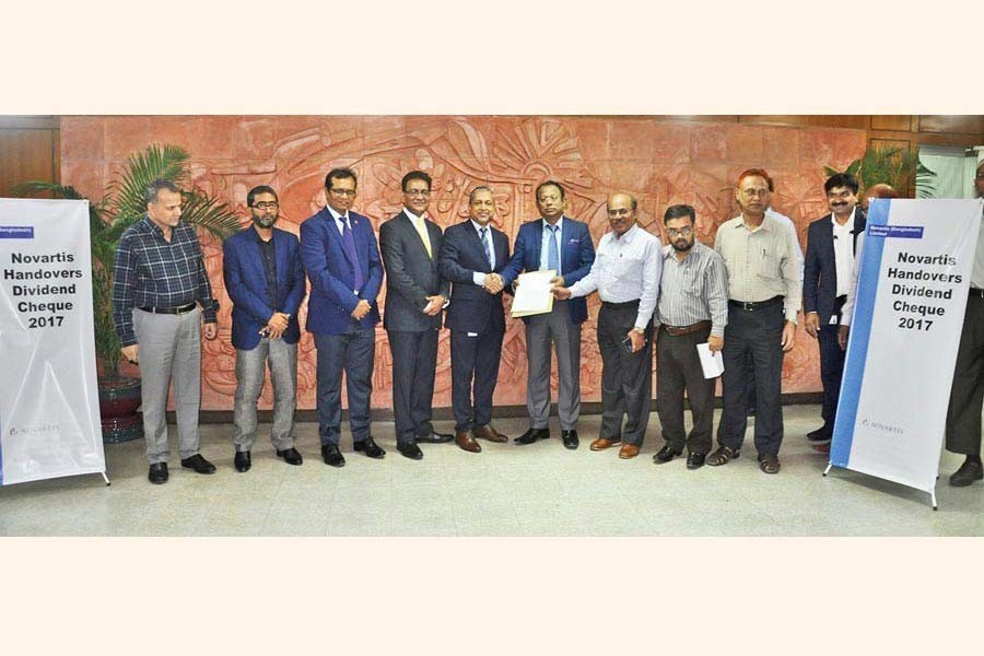 Dr. Riad Mamun Prodhani, Managing Director of Novartis (Bangladesh) Limited handing over the dividend cheque for the Financial Year 2017, to Shah Md. Aminul Haq, Chairman of Bangladesh Chemical Industries Corporation (BCIC) at BCIC headquarters recently
