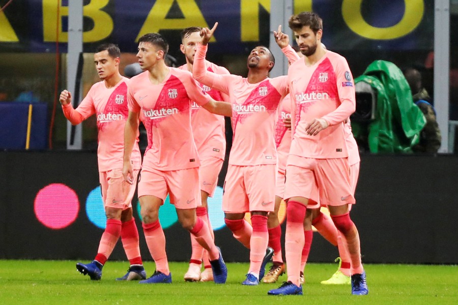 Barcelona's Brazilian Forward Malcom celebrates with teammates after opening the scoring during the clash against Inter Milan on Tuesday night at San Siro stadium — Reuters photo