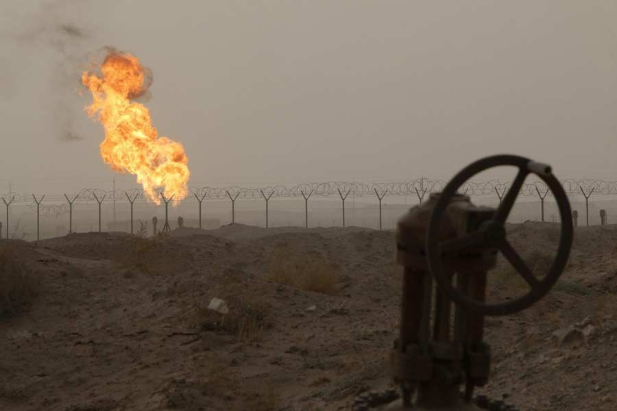 Flames emerge from a pipeline at the oil fields in Basra, southeast of Baghdad, September 30, 2016. Reuters/Files