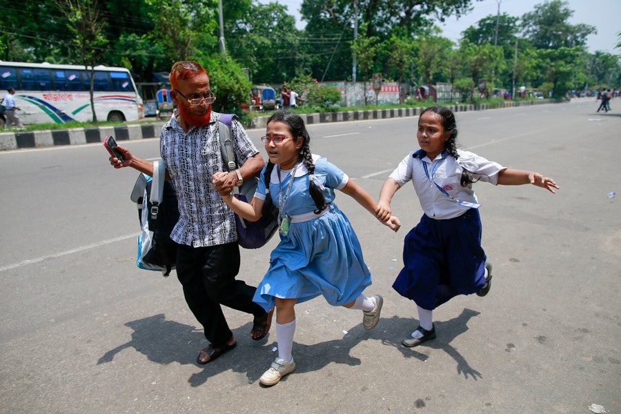 Students running for cover during a clash: Children often fall victim to violence and other types of harassment without any remedy