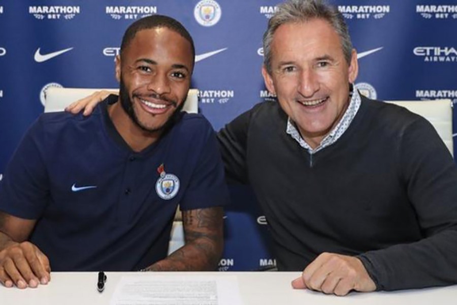 Sterling alongside Manchester City director of football Txiki Begiristain after signing his new deal. Photo: Manchester City