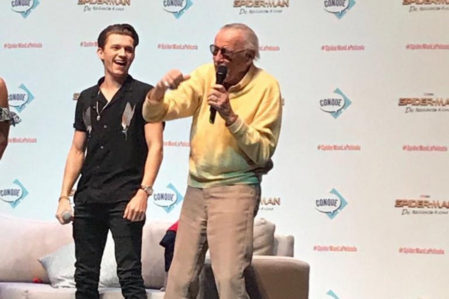 Spider-Man actor Tom Holland poses with Stan Lee at a comic convention in 2016