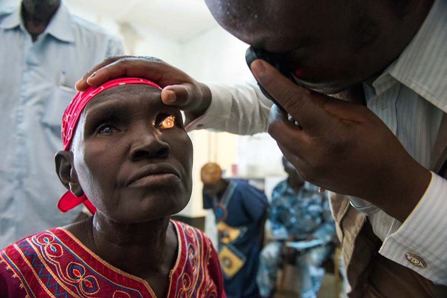 An eye surgeon examining a patient in Sudan. Internet photo