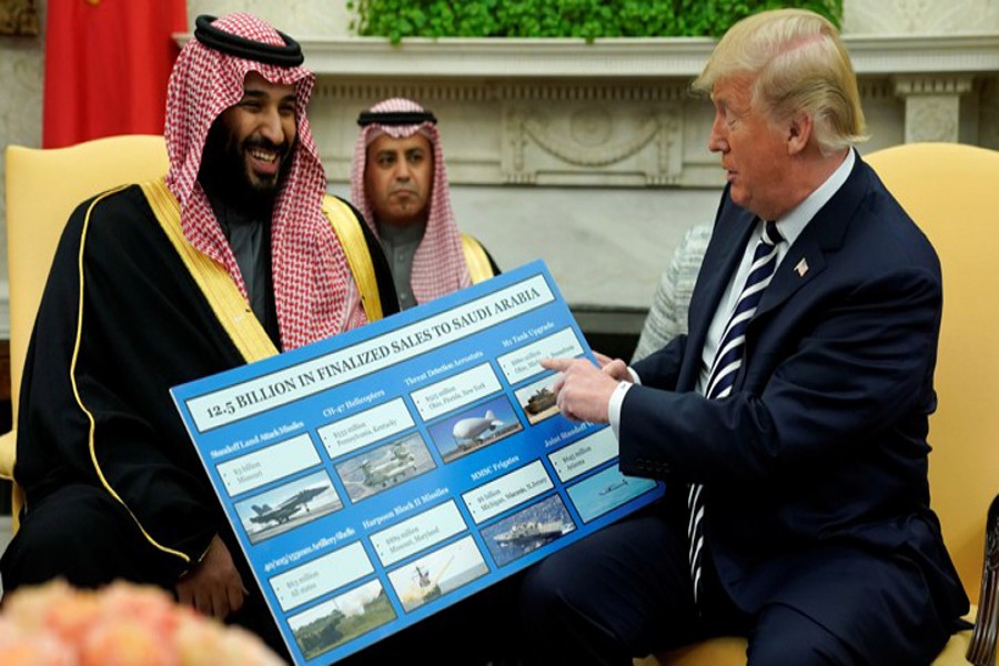 US President Donald Trump (right) holds a defence sales chart with Saudi Arabia's Crown Prince Mohammed bin Salman in the White House on March 20, 2018.  -Photo: Reuters