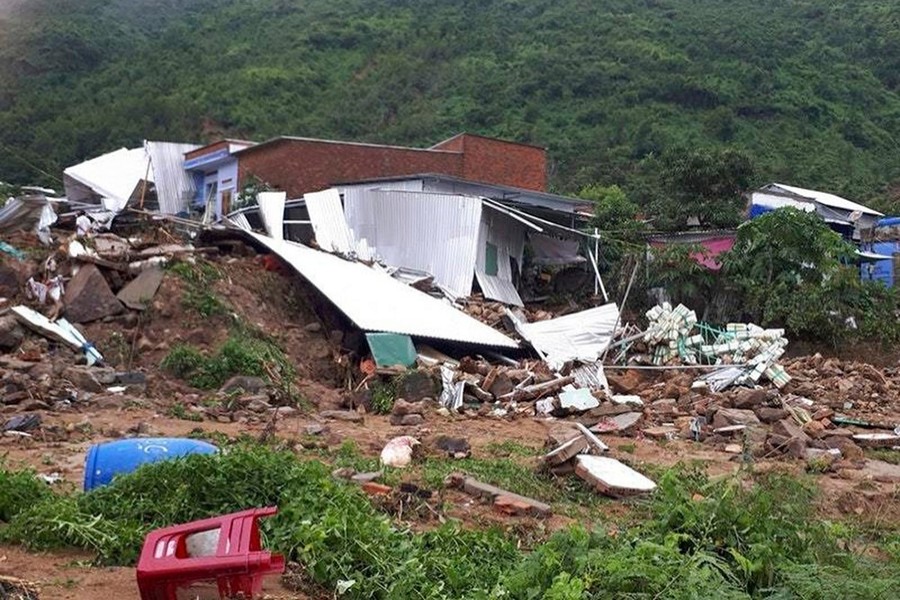 Several houses damaged by landslides in the south-central resort city of Nha Trang, Vietnam — Vietnam News Agency photo via AP