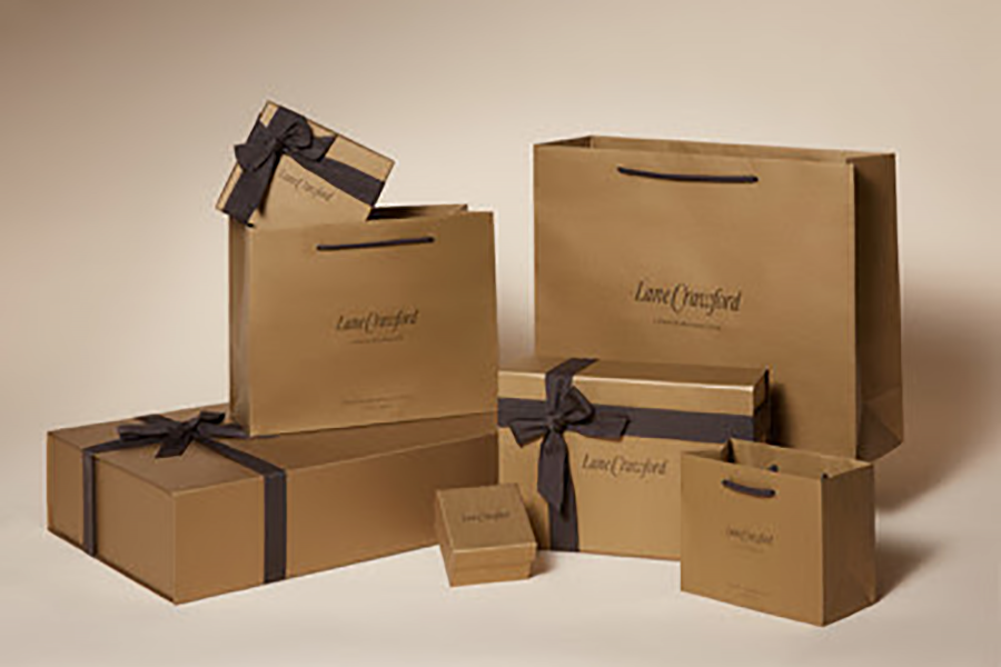 The new shopping bags remain in Lane Crawford's signature bronze colour, but are now made of FSC certified paper