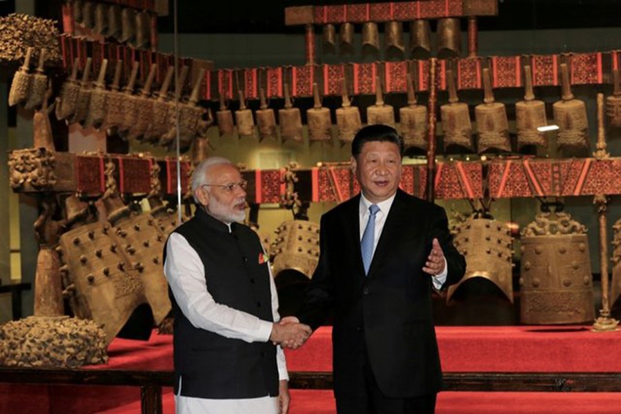 Chinese President Xi Jinping and Indian Prime Minister Narendra Modi shaking hands as they visit the Hubei Provincial Museum in Wuhan, Hubei province, China recently 	— Reuters