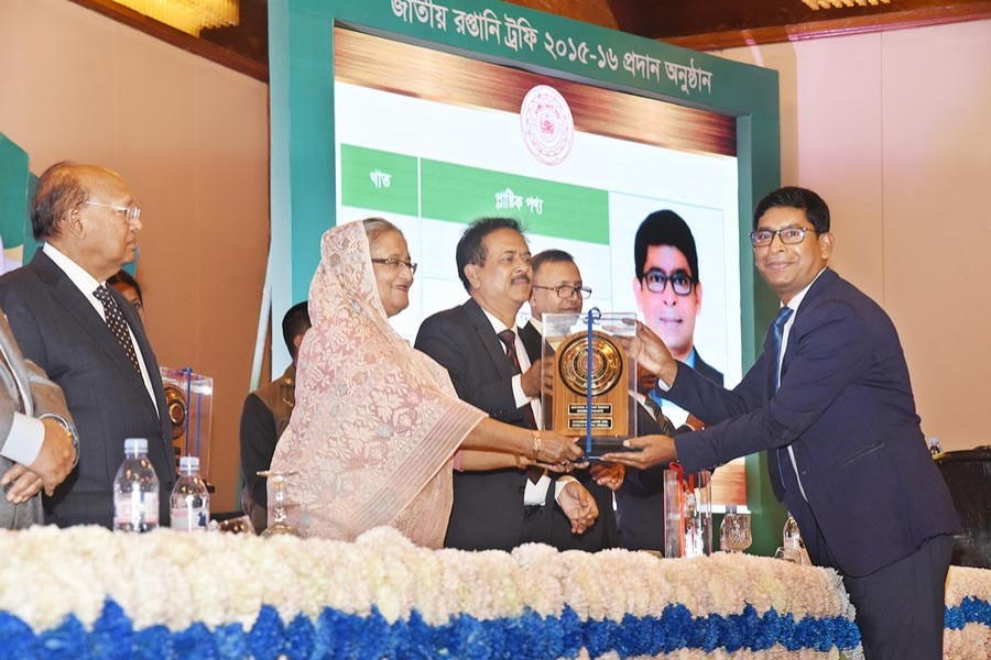 Managing Director of RFL Group RN Paul receiving the National Export Gold Trophy from Prime Minister Sheikh Hasina at a programme at a city hotel on Sunday