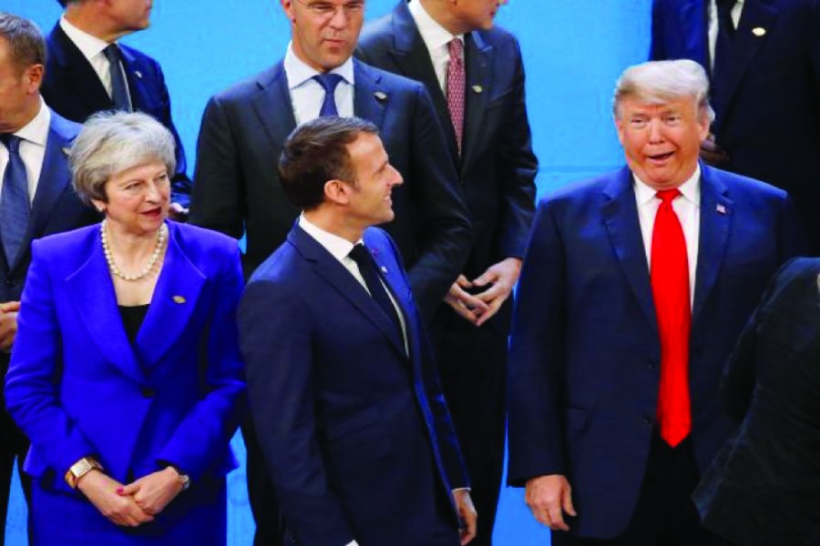 Britain's Prime Minister Theresa May, French President Emmanuel Macron and US President Donald Trump at the G20 summit in Buenos Aires, Argentina on November 30, 2018. 	—Photo: Reuters