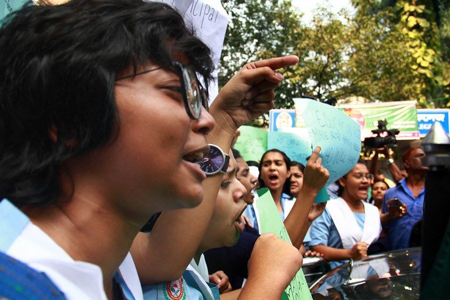 Students of Viqarunnisa Noon School and College (VNSC) protest on Tuesday demanding the resignation of College Principal Nazneen Ferdous over the suicide incident of Aritry Adhikary - a Class 9 student at the institution - Focus Bangla photo