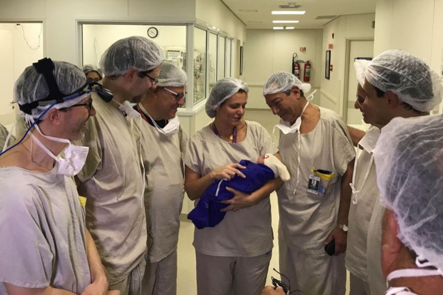 Medical team hold the first baby born via uterus transplant from a deceased donor at the hospital in Sao Paulo, Brazil December 15, 2017 in this picture handout obtained on December 4, 2018. Reuters photo