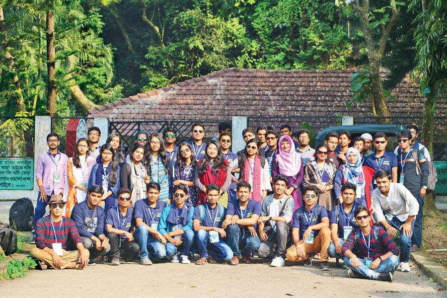 The team members of Jahangirnagar University Science Club (JUSC) pose for a photo at the entrance of Botanical Garden and Eco-park, Sitakunda, Chattogram