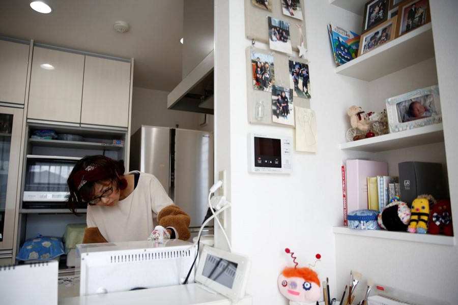 Kanako Hagiwara works in the kitchen of her house at Higashinohara district in Inzai, Chiba Prefecture, Japan, November 7, 2018. Reuters/Files