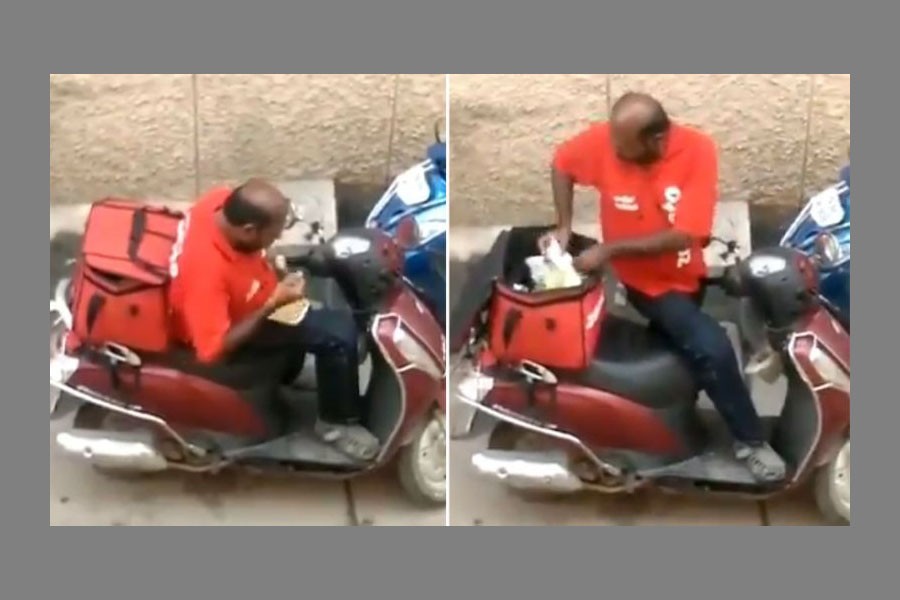 The Zomato delivery driver was filmed eating food from his delivery bag. Image: Twitter