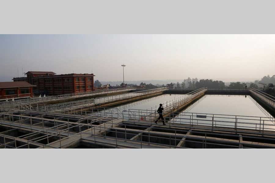 A Nepalese security guard walks at the construction site of Melamchi water project in Kathmandu, Nepal, Wednesday, Dec 19, 2018. - AP