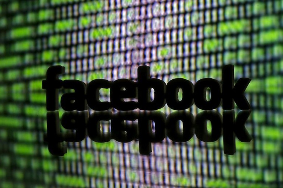 A 3D printed Facebook logo is seen in front of displayed cyber code in this illustration taken March 22, 2016. Reuters/Illustration/File Photo