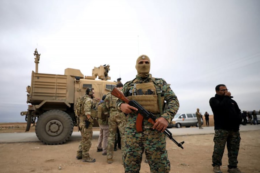 Syrian Democratic Forces and US troops during a patrol near Turkish border in Hasakah, Syria November 4, 2018. Reuters photo