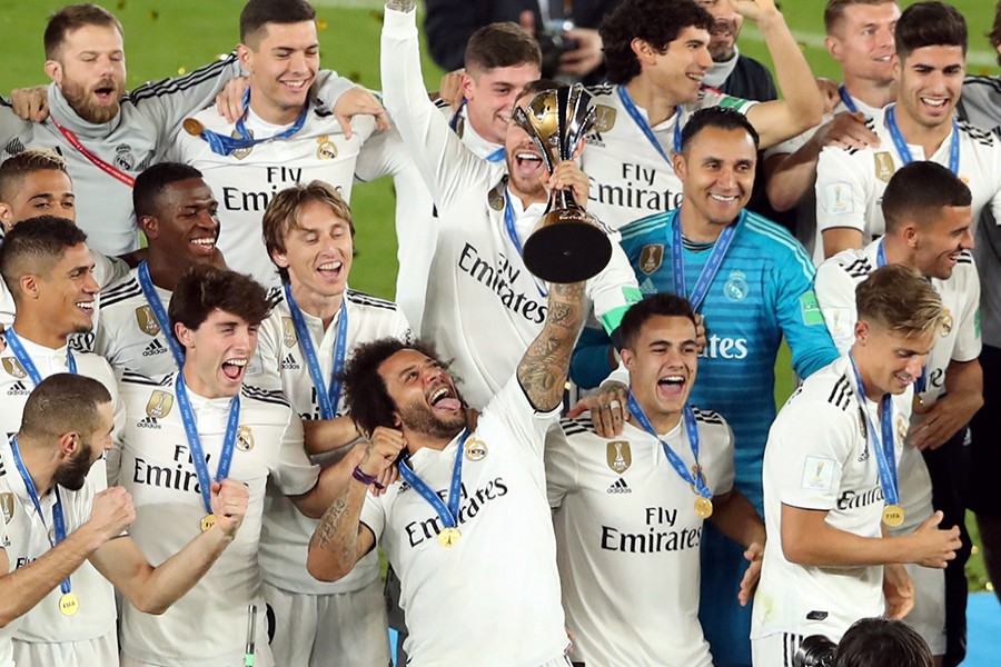 Real Madrid players celebrate with the trophy after winning the Club World Cup on Saturday — Reuters photo