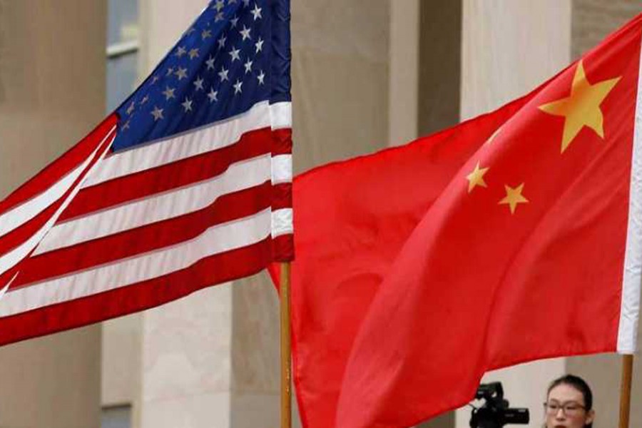 US and Chinese flags are seen before Defense Secretary James Mattis welcomes Chinese Minister of National Defense Gen. Wei Fenghe to the Pentagon in Arlington, Virginia, US, November 9, 2018. Reuters/Files