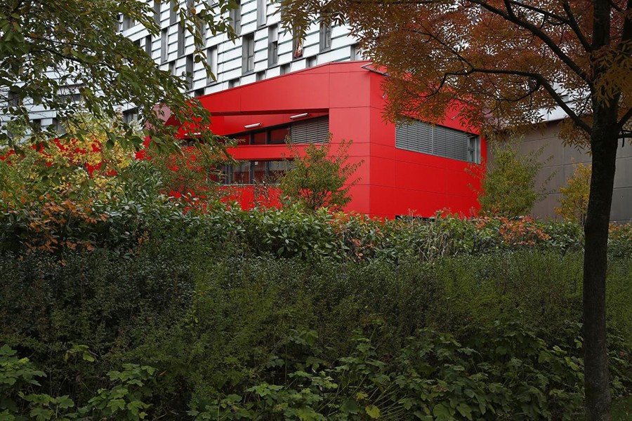 Trees and plants frame a building in the "eco-neighbourhood", Clichy-Batignolles, one of several new ecological housing developments with low energy use and carbon emissions, in Paris, France, October 22, 2015. Reuters